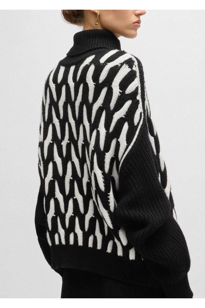 Virgin-wool sweater with two-tone cable structure