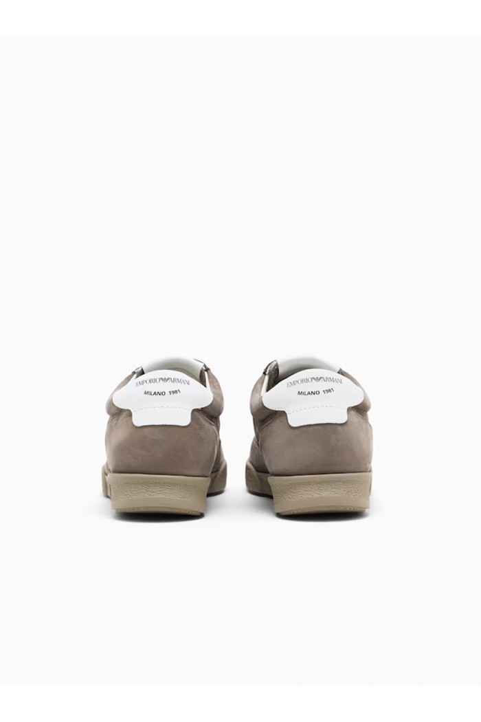 Nubuck sneakers with perforated details and a rubber sole